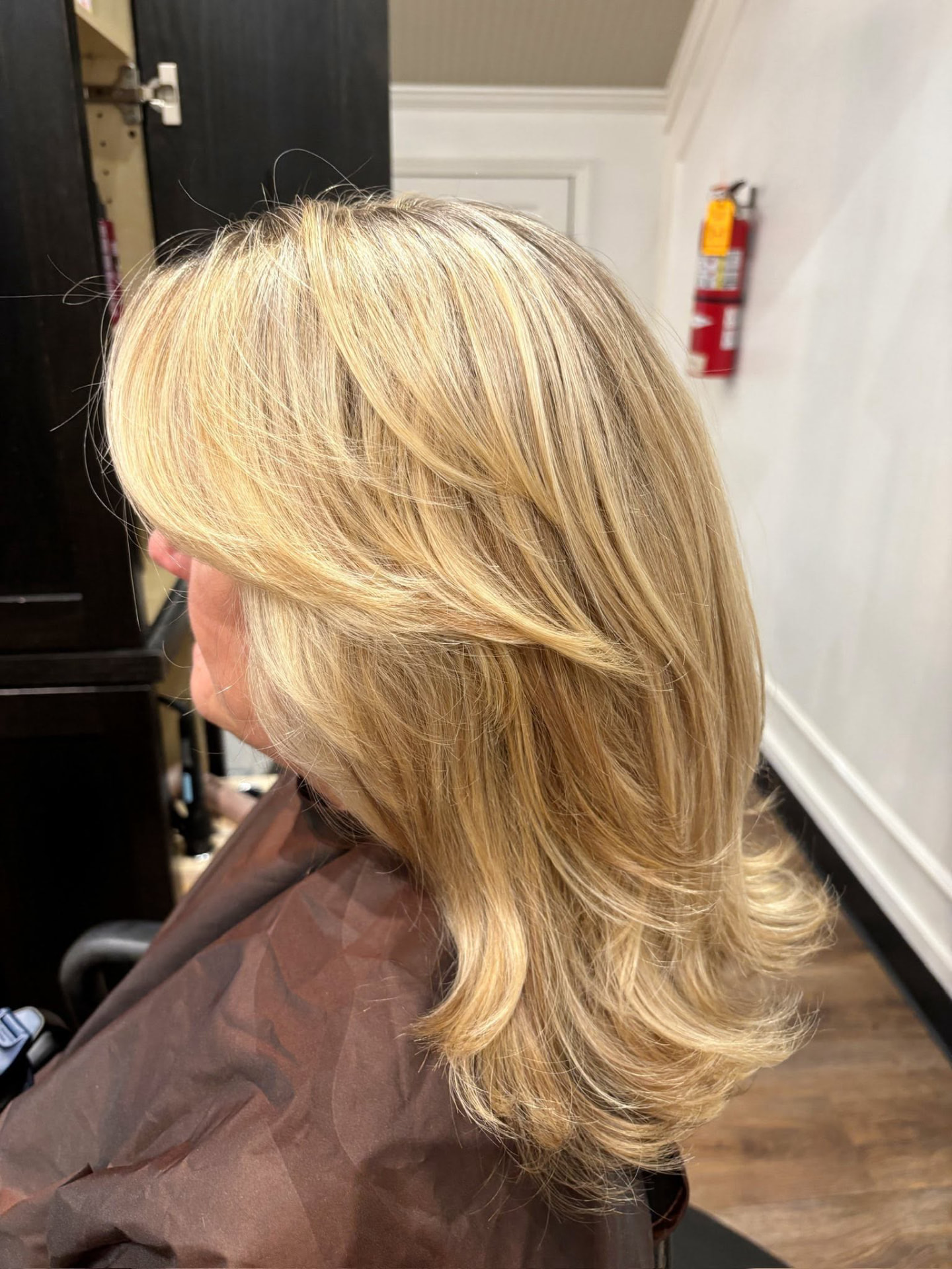 Bright buttery blonde with face-framing layers and a blowout finish by Isabella Romeo