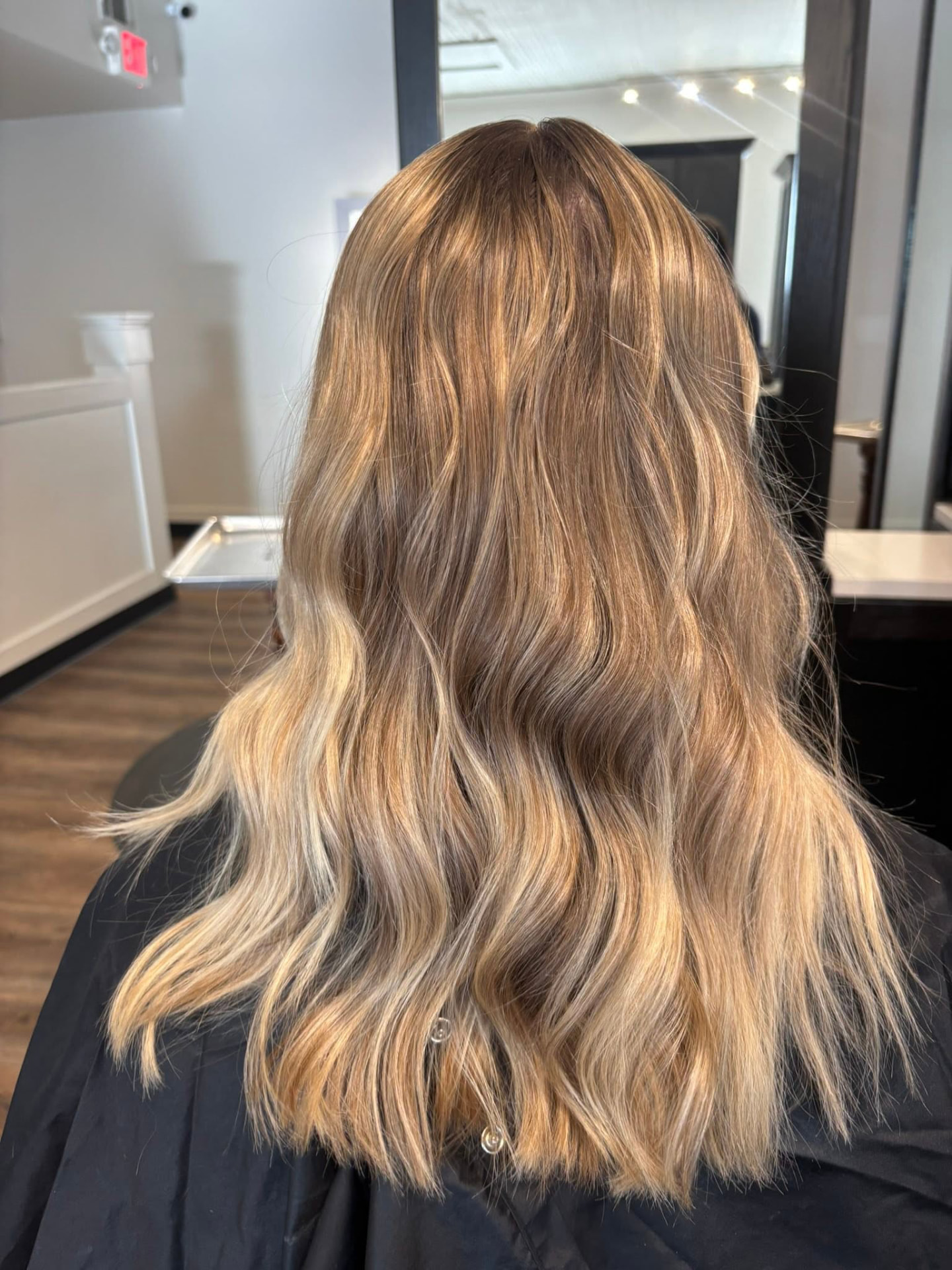 Dimensional bronde balayage with lived-in blonde ends by McAdenville, NC hair colorist Isabella Romeo
